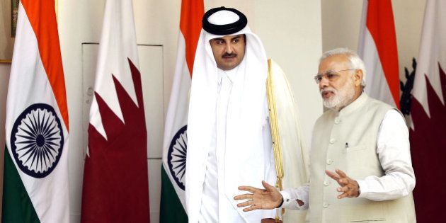 NEW DELHI, INDIA - MARCH 25: Emir of the State of Qatar Sheikh Tamim bin Hamad Al-Thani in conversatio with Prime Minister Narendra Modi prior to a meeting on March 25, 2015 in New Delhi, India. India and Qatar inked six agreements, including one on transfer of sentenced prisoners. Around 600,000 Indian nationals work in Qatar, comprising the largest expatriate community in Qatar. (Photo by Ajay Aggarwal/Hindustan Times via Getty Images)