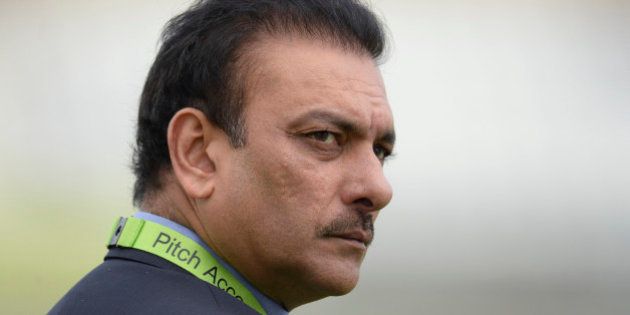 India's director of cricket Ravi Shastri looks on before the third one-day international cricket match against England at Trent Bridge cricket ground, Nottingham, England August 30, 2014. REUTERS/Philip Brown (BRITAIN - Tags: SPORT CRICKET)
