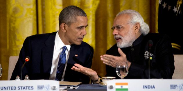FILE - In this March 31, 2016, file photo, President Barack Obama talks with India's Prime Minister Narendra Modi during a working dinner with heads of delegations of the Nuclear Security Summit in the East Room of the White House, in Washington. After years of being denied entry to the U.S., Modi has become a welcome guest in Washington, forging a surprising bond with President Barack Obama and deepening ties with America. (AP Photo/Carolyn Kaster, File)