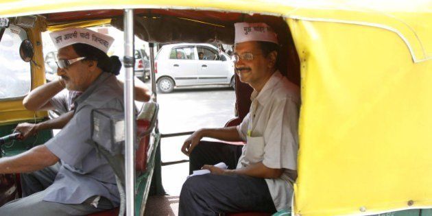 NEW DELHI, INDIA - JUNE 10: Aam Aadmi Party leader Arvind Kejriwal taking ride on Auto rickshaws during auto drivers protest against the Delhi government's plan to ban advertisements on three-wheelers at Janta Mantar on June 10, 2013 in New Delhi, India. (Photo by Virendra Singh Gosain/Hindustan Times via Getty Images)