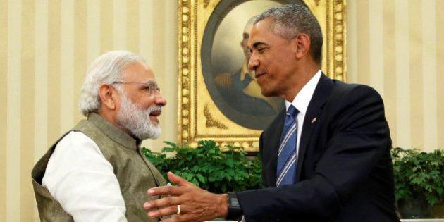 U.S. President Barack Obama (R) shakes hands with India's Prime Minister Narendra Modi after their remarks to reporters following a meeting in the Oval Office at the White House in Washington, U.S. June 7, 2016. REUTERS/Jonathan Ernst TPX IMAGES OF THE DAY