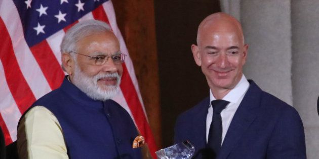 WASHINGTON, DC - JUNE 07: Jeff Bezos, CEO of Amazon,(R), is presented with the 2016 USIBC Global Leadership Award by Indian Prime Minister Narendra Modi during the 41st Annual Leadership Summit at the Mellen Auditorium, June 7, 2016 in Washington, DC. . (Photo by Mark Wilson/Getty Images)