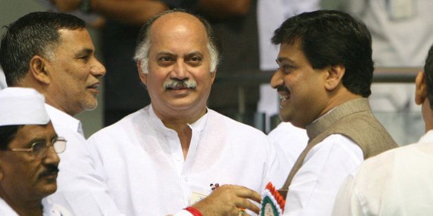 NEW DELHI, INDIA ï¿½ NOVEMBER 2: Maharashtra Chief Minister Ashok Chavan and Minister of State for IT, Gurudas Kamat during the Meeting of All India Congress Committee (AICC) members at Talkatora Stadium in New Delhi on November 2, 2010. (Photo by Naveen Jora/India Today Group/Getty Images)