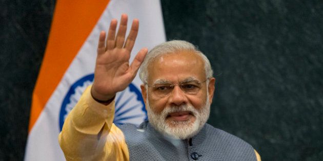 Prime Minister of India Narendra Modi waves following a joint statement to the press with Mexican President Enrique Pena Nieto, in Los Pinos presidential residence in Mexico City, Wednesday, June 8, 2016. Modi met with the Mexican President Wednesday evening during a short working visit to the country.(AP Photo/Rebecca Blackwell)
