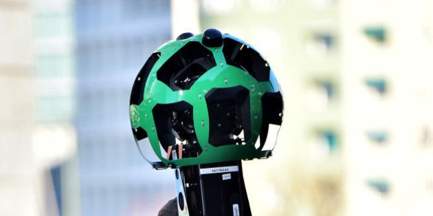 Daniele Rizzetto, computer engineer, walks carrying a Street View trekker backpack with a 360Â° camera system on top, on February 5, 2016 in central Milan. The technology, first introduced in 2012, allows them to capture places around the world inaccessible by car. According to Google, the Trekker is worn by an operator and walked through pedestrian walkways or trails on foot, gathering images as it goes. The images are stitched together to create the 360-degree panoramas seen on Google Maps. AFP PHOTO / GIUSEPPE CACACE / AFP / GIUSEPPE CACACE (Photo credit should read GIUSEPPE CACACE/AFP/Getty Images)