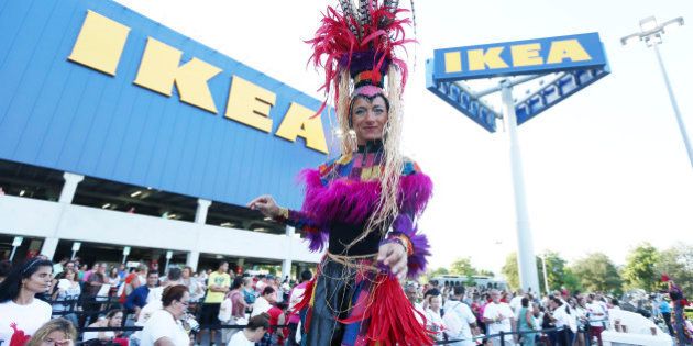 A stilt-walker dances as people wait for IKEA, the worldâs leading home furnishings retailer. to open the doors of its first Miami-Dade store to customers, in Sweetwater, Fla., Wednesday, Aug. 27, 2014. The 416,000-square-foot IKEA Miami is located on 14.6 acres It is the Swedish companyâs second store in South Florida, the fourth in the state, and the 39th in the United States .(AP Photo/J Pat Carter)