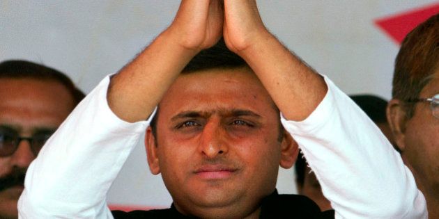 Samajwadi Party (SP) leader Akhilesh Yadav gestures to his supporters during his oath taking ceremony as the Chief Minister of Uttar Pradesh in Lucknow, India, Thursday, March 15, 2012. Yadav, 38, who played a major role in revival of socialist Samajwadi Party fortunes in the recently concluded state elections, is the youngest chief minister of India's most populous state. (AP Photo/Rajesh Kumar Singh)
