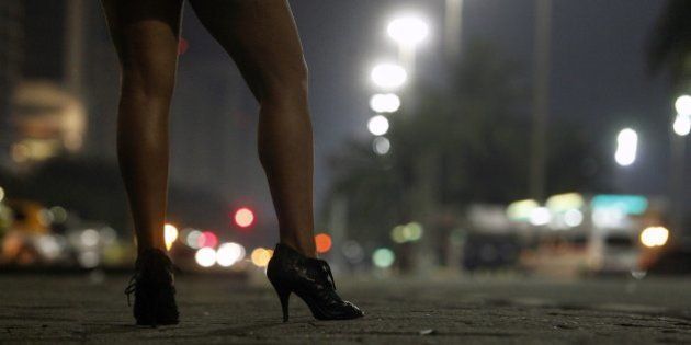 Prostitute at Atlantica avenue in copacabana beach at night, Rio de Janeiro