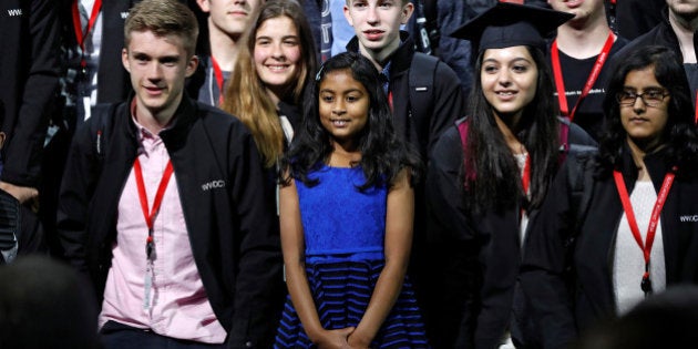 Nine-year-old Anvitha Vijay (C), the youngest developer to attend the Apple World Wide Developers Conference, poses for a group photo after the keynote in San Francisco, California, U.S., June 13, 2016. REUTERS/Stephen Lam