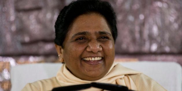India's Bahujan Samaj Party (BSP) chief Mayawati smiles as she addresses journalists at a press conference in New Delhi, India, Tuesday, Sept. 22, 2015. The Central Bureau of Investigation (CBI) is likely to soon question the former chief minister of Uttar Pradesh state and BSP chief in connection with alleged swindling of funds running into millions of US dollars in the implementation of National Rural Health Mission under her watch. (AP Photo/Saurabh Das)