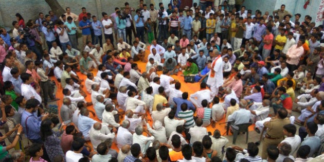 DADRI, INDIA - JUNE 6: (Editorâs Note: This image is available in Low resolution only) Defying the prohibitory orders imposed by the district administration, residents of Bishada and neighbouring villages hold a protest meeting demanding that an FIR be registered against the victims family for alleged cow slaughter nearly nine months after the Dadri lynching on June 6, 2016 in Dadri, India. The demand was sparked after a forensic report stated that the meat found at the scene of the attack on Mohammad Akhlaq on the night of September 28 following rumours that his family stored and ate beef at their house was that of cow or its progeny. (Photo by Sunil Sharma/Hindustan Times via Getty Images)