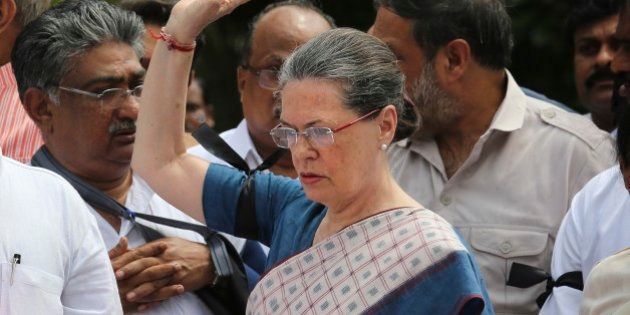 Indiaâs opposition Congress party president Sonia Gandhi, centre, leads other Congress party lawmakers during a protest in the parliament premises, in New Delhi, India, Tuesday, Aug. 4, 2015. Tuesdayâs protest followed after the speaker of India's Parliament on Monday barred 25 opposition legislators from its sessions for the rest of the week for causing