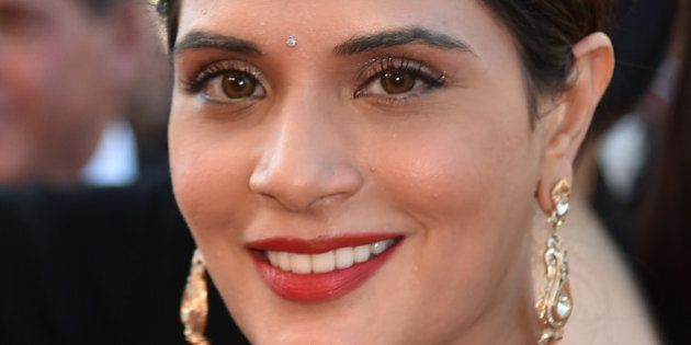 Indian actress Richa Chadha smiles as she arrives on May 15, 2016 for the screening of the film 'Mal de Pierres (From the Land of the Moon)' at the 69th Cannes Film Festival in Cannes, southern France. / AFP / ALBERTO PIZZOLI (Photo credit should read ALBERTO PIZZOLI/AFP/Getty Images)