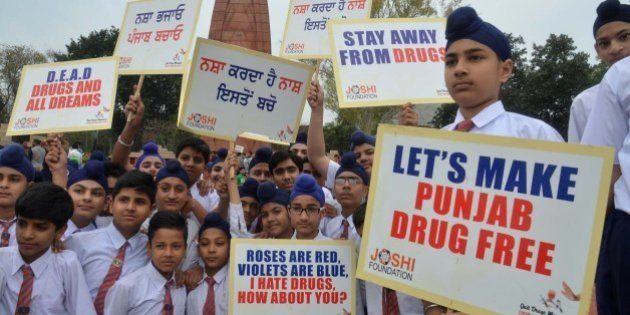Indian students hold placards as they participate in an anti-drugs awareness march organized by the Joshi Foundation in Amritsar on April 7, 2015. AFP PHOTO/NARINDER NANU (Photo credit should read NARINDER NANU/AFP/Getty Images)