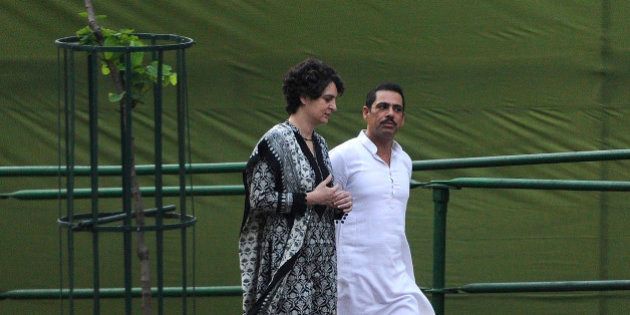 NEW DELHI, INDIA - AUGUST 20: Former Prime Minister Rajiv Gandhi's daughter Priyanka Gandhi with her husband Robert Vadra takes part in a remembrance ceremony to mark Rajiv Gandhi's 71st birth anniversary at Veer Bhumi, on August 20, 2015 in New Delhi, India. Rajiv Gandhi was assassinated during electoral campaigning, allegedly by Liberation Tigers of Tamil Eelam (LTTE) rebel separatists, in the town of Sriperumpudur, in the southern state of Tamil Nadu on May 21, 1991. (Photo by Sonu Mehta/Hindustan Times via Getty Images)