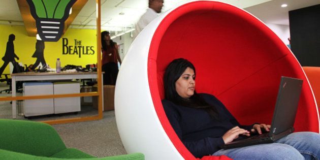 An employees sits in a chair working on a laptop computer in the office of Myntra.com, a unit of Flipkart Internet Services Pvt., in Bangaluru, India, on Friday, Dec. 04, 2015. Discounts and cashback offers helped India's top e-commerce companies from Flipkart to Snapdeal sell a record $11 billion of goods this year online. Photographer: Namas Bhojani/Bloomberg via Getty Images