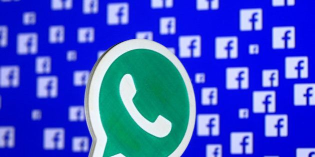 A 3D printed Whatsapp logo is seen in front of a displayed stock graph in this illustration taken April 28, 2016. REUTERS/Dado Ruvic/Illustration