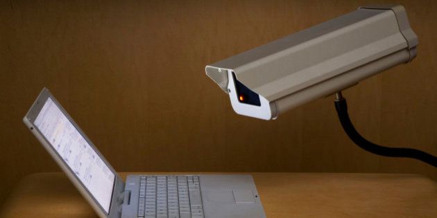 Surveillance camera peering into laptop computer