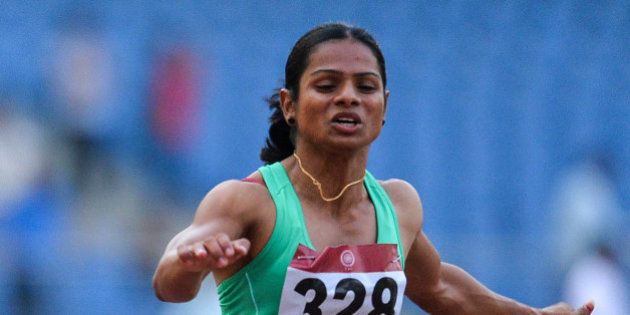 Dutee Chand of Odisha takes part in the 100 metre race during 20th Federation Cup National Senior Athletics Championship in New Delhi on April 28, 2016. / AFP / CHANDAN KHANNA (Photo credit should read CHANDAN KHANNA/AFP/Getty Images)
