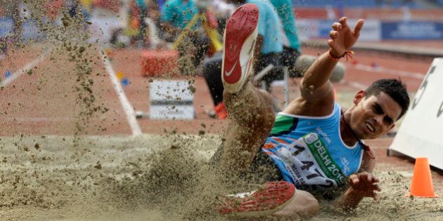 India's Ankit Sharma competes in a Men's Long Jump qualification during the Commonwealth Games at the Jawaharlal Nehru Stadium in New Delhi, India, Friday, Oct. 8, 2010. (AP Photo/Lee Jin-man)