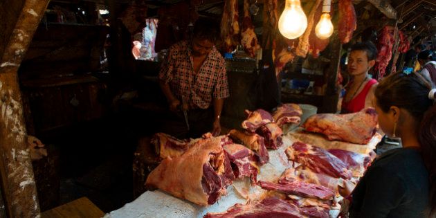 SHILLONG, MEGHALAYA, INDIA - 2016/05/17: A man sells beef at Iewduh Bazar in Shillong, Meghalaya. Lewduh, also known as Bara Bazar, is a bustling marketplace in Shillong that earns immense popularity as one of the biggest and oldest trade centres in the northeast of India. A special thing about this market is that most of the shopkeepers are women from local villages. An array of things is on sale here, including seasonal vegetables, fruits, exotic spices and handicrafts. (Photo by Subhendu Sarkar/LightRocket via Getty Images)