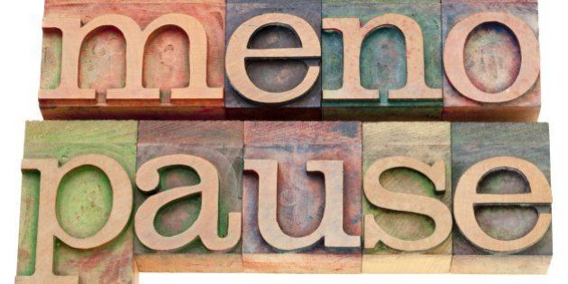 menopause - isolated word in vintage wood letterpress printing blocks stained by color inks