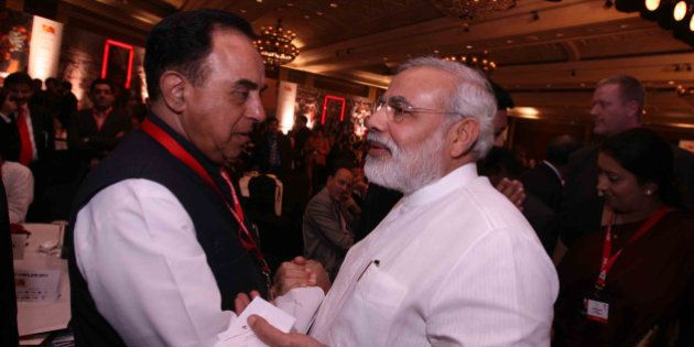 NEW DELHI, INDIA - MARCH 18: Gujarat Chief Minister Narendra Modi and Janta Dal Chief Subramanian Swamy at the 10th India Today Conclave being held in the capital on March 18-19, 2011 at Taj Palace Hotel. (Photo by Shekhar Yadav/India Today Group/Getty Images)