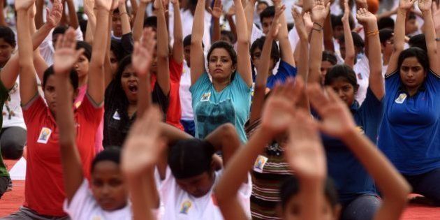 Indian students participate in a yoga demonstration on International Yoga Day in Chennai on June 21, 2016Yoga, which means union in Sanskrit, is a family of ancient spiritual practices and also a school of spiritual thought from the South East Asian continent, where it remains a vibrant living tradition and is seen as a means of enlightenment. / AFP / ARUN SANKAR (Photo credit should read ARUN SANKAR/AFP/Getty Images)