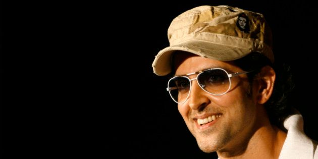 Bollywood actor Hrithik Roshan smiles during a promotional event of a beverage manufacturing company in New Delhi May 23, 2008. REUTERS/Vijay Mathur (INDIA)