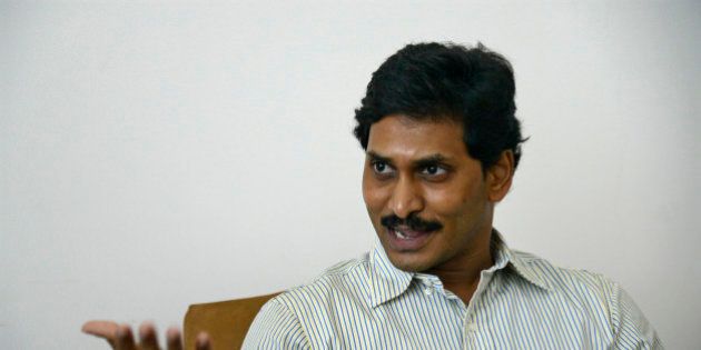 Jagan Mohan Reddy, the leader of YSR Congress party speaks during an interview with Reuters at his residence in the southern Indian city of Hyderabad October 16, 2013. When Jagan Mohan Reddy finally emerged from 16 months behind bars in southern India in September, the adoring crowd that greeted the young politician was so enormous that it took him six hours to drive the 11 km (7 miles) to his home. The scene underscored Reddy's growing popularity - despite a thicket of corruption scandals around him - and it served as a rude reminder to national leaders up north in New Delhi that regional party bosses like Reddy will hold the key to power after elections next year. Both the ruling Congress party and the main opposition Bharatiya Janata Party (BJP) are expected to fall short of a majority in the election, which means India may be heading for a coalition government dependent on regional parties. Picture taken October 16, 2013. REUTERS/Krishnendu Halder (INDIA - Tags: POLITICS)