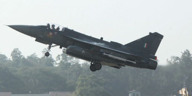 A HAL Tejas multirole light combat aircraft takes off for the type's initial operational clearance for induction into the Indian Air Force, in Bangalore on December 20, 2013. The Indian-built LCA (Light Combat Aircraft)Tejas received its Initial Operational Clearance (IOC II) on December 20, bringing it closer to the aircraft's induction into IAF service, a report said. AFP PHOTO/STR (Photo credit should read STRDEL/AFP/Getty Images)
