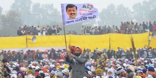 BATHINDA, INDIA - JANUARY 14: Aam Aadmi Party supporters during a public rally of Delhi Chief Minister Arvind Kejriwal on the occasion of Maghi Mela (festival) at Muktsar on January 14, 2016 in Bathinda, India. Giving a kick-start to AAPâs campaign for 2017 Punjab polls, its convener Arvind Kejriwal launched a scathing attack on both Akalis and Congress, accusing them of being hand in glove with each other, and asked people to vote for AAP to end corruption, drug abuse, farmer suicides and put the state back on right track. (Photo by Sameer Sehgal/Hindustan Times via Getty Images)