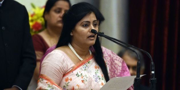 Bharatiya Janata Party (BJP) politician, Anupriya Singh Patel takes the oath during the swearing-in ceremony of new ministers following Prime Minister Narendra Modi's cabinet re-shuffle, at the Presidential Palace in New Delhi on July 5, 2016.Indian Prime Minister Narendra Modi revamped his cabinet on July 5 bringing in 19 new junior ministers to speed up decision-making and delivery on promises made in this year's budget. / AFP / Prakash SINGH (Photo credit should read PRAKASH SINGH/AFP/Getty Images)
