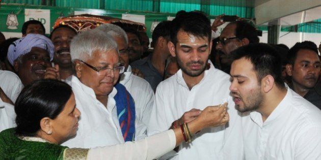 PATNA, INDIA - JUNE 11: RJD Chief Lalu Prasad Yadav Lalu Yadav celebrated his 69th birthday with his wife, Rabri Devi and two sons Tejaswi Yadav and Tej Pratap Yadav, on June 11, 2016 in Patna, India. The veteran politician of Bihar was greeted by a number of state leaders cutting across political lines. (Photo by AP Dube/Hindustan Times via Getty Images)