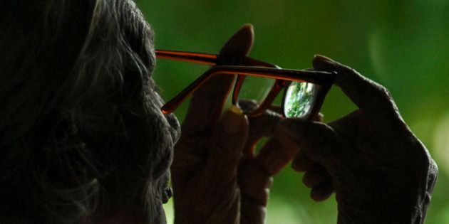 Grace, 90, looks through her glasses after a cataract surgery in Hyderabad, India, Wednesday, Oct. 8, 2008, on the eve of World Sight Day. (AP Photo/Mahesh Kumar A.)