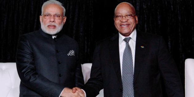 South African President Jacob Zuma (R) and Indian Prime Minister Narendra Modi shake hands as they attend the South Africa-India Business Forum at the CSIR International Convention Centre in Pretoria on July 8, 2016.Indian Prime Minister Narendra Modi took his Africa tour to South Africa on July 8, seeking to boost trade between two countries that he said 'shared values, suffering and struggles'. / AFP / KAREL PRINSLOO (Photo credit should read KAREL PRINSLOO/AFP/Getty Images)