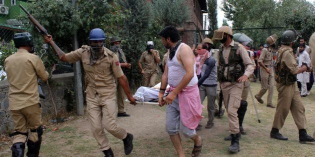 Indian police carry the body of a slain youth outside a hospital in Srinagar on July 9, 2016.Clashes spread across the disputed territory as protesters angry at the killing on Friday of Hizbul Mujahideen (HM) leader Burhan Wani torched police stations and threw rocks at army camps in the south of the restive region.Four have died of bullet wounds and 60 injured have been brought in so far, six of them are in a critical condition,' a staff member at a hospital in the southern town of Anantnag told AFP, asking to remain anonymous. / AFP / - (Photo credit should read -/AFP/Getty Images)