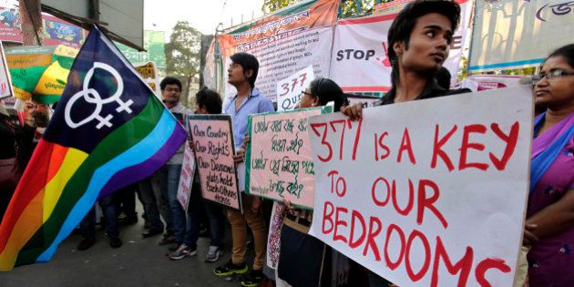 Indian gay rights activists hold placards during a protest against a Supreme Court verdict that upheld section 377 of the Indian Penal Code that criminalizes homosexuality in Kolkata, India, Monday, Dec. 16, 2013. The Supreme Court ruled Wednesday that only lawmakers could change a colonial-era law that bans same-sex relations and makes them punishable by up to a decade in prison. (AP Photo/Bikas Das)