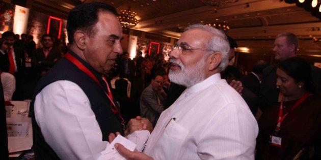 NEW DELHI, INDIA - MARCH 18: Gujarat Chief Minister Narendra Modi and Janta Dal Chief Subramanian Swamy at the 10th India Today Conclave being held in the capital on March 18-19, 2011 at Taj Palace Hotel. (Photo by Shekhar Yadav/India Today Group/Getty Images)