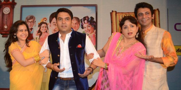 Indian comedy actor Kapil Sharma (C), Sunil Grover (R), actresses Upasana Singh (2R), and Sumona Chakravarti (L) pose during a press conference at a hotel in Amritsar on June 8, 2013. The entertainers visited the Punjabi city to promote a new TV series Comedy Nights with Kapil which will be telecasting on Colour TV Channel on June 22. AFP PHOTO/ NARINDER NANU (Photo credit should read NARINDER NANU/AFP/Getty Images)