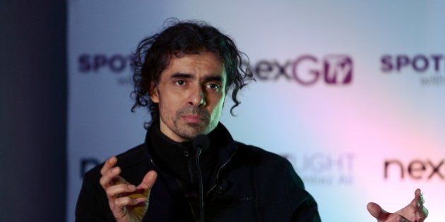 Bollywood director Imtiaz Ali gestures as he speaks during an event to launch new project 'SPOTLight' by nextGTV, in New Delhi on December 21, 2015. AFP PHOTO / Money SHARMA / AFP / MONEY SHARMA (Photo credit should read MONEY SHARMA/AFP/Getty Images)