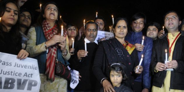 NEW DELHI, INDIA - DECEMBER 21: Parents of Nirbhaya alongwith activists during a protest against the release of juvenile convict of the 16 December Gang-rape on December 21, 2015 in New Delhi, India. As pressure mounted on it for early passage of the Juvenile Justice Bill, government today listed the crucial legislation in Rajya Sabha for passage tomorrow and blamed Congress for blocking it in the past due to its obstructionist politics even when it was listed on 15 occasions. (Photo by Sushil Kumar/Hindustan Times via Getty Images)