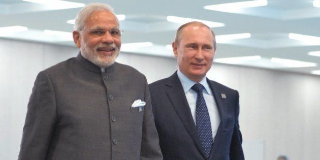 Indian Prime Minister Narendra Modi, left, Russian President Vladimir Putin walk during the Shanghai Cooperation Organization (SCO) summit in Ufa, Russia, Friday, July 10, 2015. (RIA Novosti Pool Photo via AP)