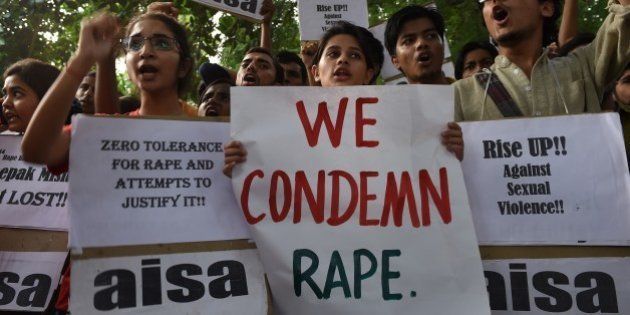 Indian students shout slogans during a protest against the rapes of two minor girls outside the police headquarters in New Delhi on October 18, 2015. Indian police said October 17 they have arrested two teenagers over the rape of a two-year-old girl, who was found bleeding in a park near her New Delhi home on the night of October 16. AFP PHOTO / SAJJAD HUSSAIN (Photo credit should read SAJJAD HUSSAIN/AFP/Getty Images)