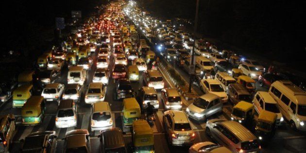 NEW DELHI, INDIA - NOVEMBER 17: Traffic Jam near ITO during the Chhath festival, on November 17, 2015 in New Delhi, India. Chhath festival, also known as Surya Pooja (worship of the sun), is observed in eastern parts of India where homage is paid to the sun and water Gods eight days after Diwali, the festival of lights. During Chhath festival, devotees undergo a fast and offer water and milk to the Sun God at dawn and dusk. The Goddess who is worshipped during the famous Chhath Puja is known as Chhathi Maiya. Chhathi Maiya is known as [goddess] in the Vedas. She is believed to be the beloved younger sister of Surya, the sun god. Some scholars believed that she is the only sister of sun god. The Chhath Puja is performed in order to thank Surya for sustaining life on earth and to request the granting of certain wishes. This festival is observed by people living in Nepal and India (mainly in the State of Bihar and Uttar Pradesh. (Photo by Sonu Mehta/Hindustan Times via Getty Images)