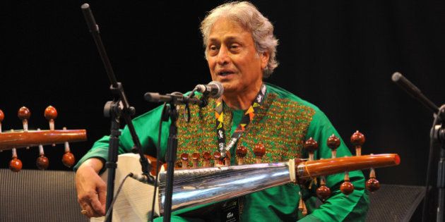 WILTSHIRE, UNITED KINGDOM - JULY 26: Amjad Ali Khan performs on stage at the Womad Festival at Charlton Park on July 26, 2014 in Wiltshire, United Kingdom. (Photo by C Brandon/Redferns via Getty Images)
