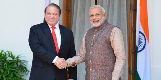 NEW DELHI, INDIA MAY 27: Pakistani Prime Minister Nawaz Sharif shakes hands with Prime Minister Narendra Modi after the swearing-in ceremony of the NDA government in New Delhi on Tuesday, May 27, 1014.(Photo by Yasbant Negi/India Today Group/Getty Images)