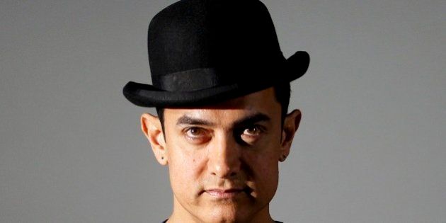 Bollywood actor Aamir Khan attends a trailer launch of his film Dhoom 3 in Mumbai, India, Wednesday, Oct. 30, 2013. Dhoom 3 is a Hindu action thriller film that will be released on Dec. 20. (AP Photo/Rajanish Kakade)