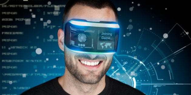 Man using a virtual reality headset for playing video games.