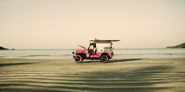 Red jeep on the beach